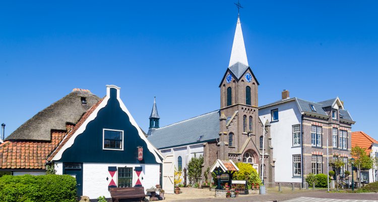 Village Oudeschild with Martinus church and trraditional gable  houses on the Wadden island Texel in the Netherlands